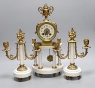 A four pillar French white marble and gilt metal clock garniture,43 cms high,