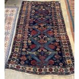 A Caucasian blue ground rug, 254 x 142cm
