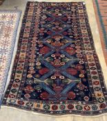 A Caucasian blue ground rug, 254 x 142cm