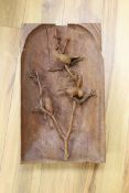 A large alpine wood carving - three birds, one detached section,31 cms x 52 cms,