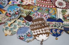 Three Victorian beadwork bags, circa 1860, largest 17cm high, and a collection of eleven smaller