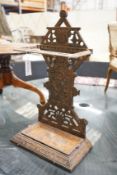 A late Victorian aesthetic movement cast-iron stickstand, width 40cm, depth 22cm, height 69cm