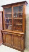 A late Victorian mahogany bookcase, length 122cm, depth 41cm, height 218cm