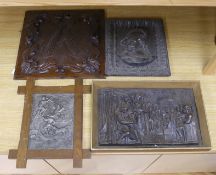 Three assorted cast metal panels together with a carved walnut panel, 39x40cm