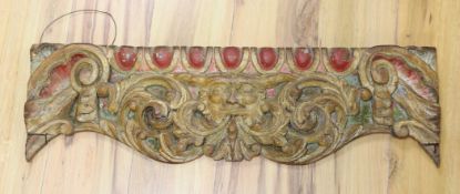 A carved wood 'fairground' panel,76 cms wide,