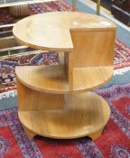 An Art Deco style walnut circular three tier occasional table, diameter 50cm, height 53cm