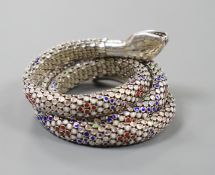 A continental 935 white metal and polychrome enamel set coiled serpent bangle.