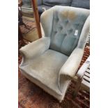 A late Victorian upholstered wing armchair, width 76cm, depth 82cm, height 90cm