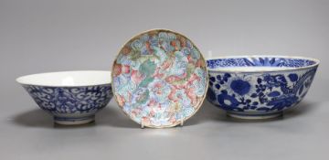 A Chinese blue and white dragon bowl, another blue and white bowl and a saucer, 19th century,