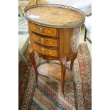 An early 20th century French marquetry oval three drawer small chest, width 50cm, depth 36cm, height