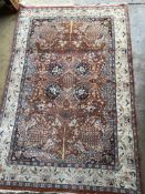 A North West Persian style brick red ground rug, 190 x 126cm
