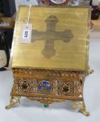 A gilt brass bible stand