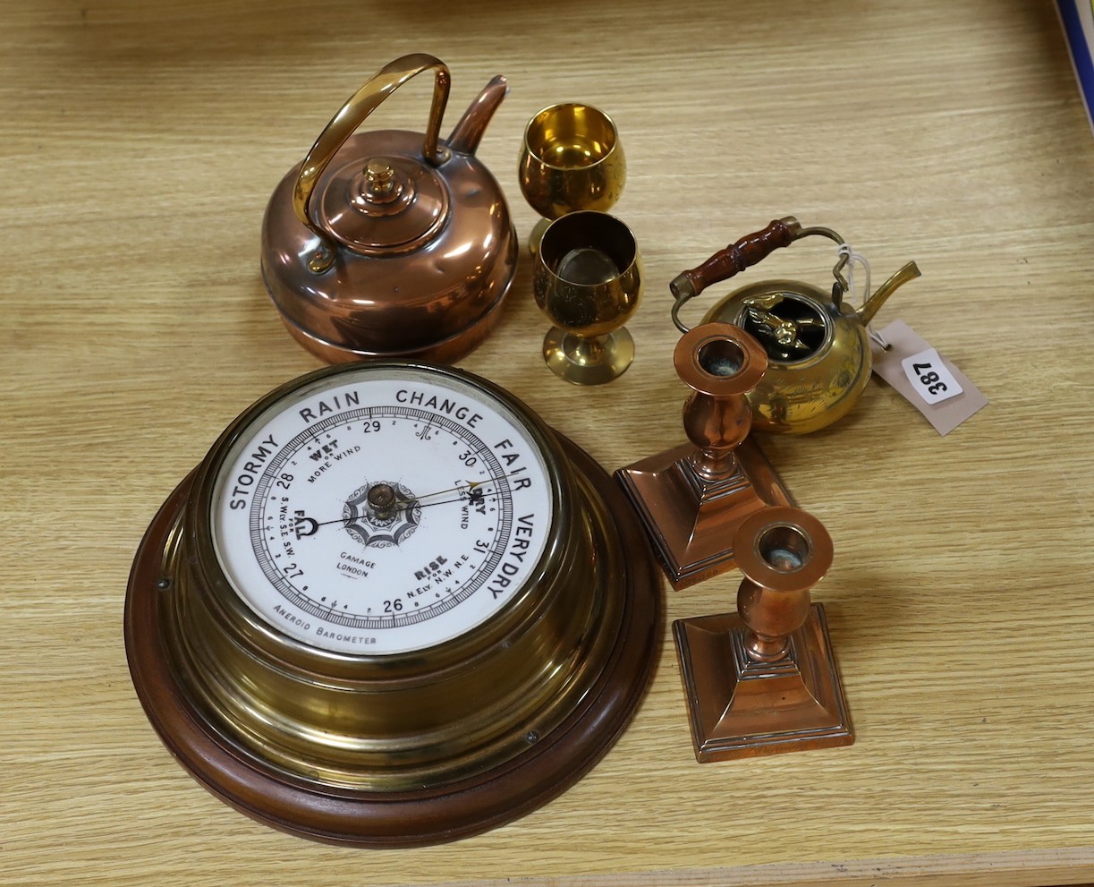 A Gamages aneroid barometer and a group of metalware,barometer 36 cms diameter including wooden
