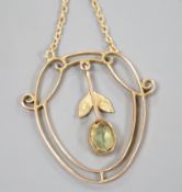 An Edwardian 9ct, peridot and seed pearl set drop pendant, 25mm, gross weight 1.6 grams.