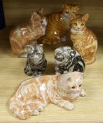 Three large Winstanley pottery models of cats, size 5 and 6, two similar size 4 cats and a Just Cats