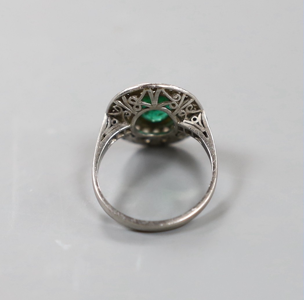 A white metal, emerald and diamond set oval cluster ring, size I/J, gross weight 3.8 grams. - Image 3 of 3