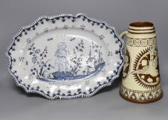A Brannum sgraffito jug and a French faience serving dish, 42cm