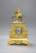 A French ormolu silk suspension clock depicting Napoleon on horseback, with pendulum, 36cm tall