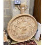 A carved pine model of a pocket watch, height 110cm