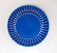 A Chinese blue monochrome earthenware dish, 15.5 cms diameter