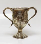A George III silver two-handled cup, with later embossed decoration, Peter, Ann & William Bateman,
