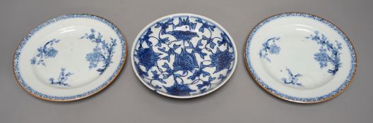 A pair of 18th-century Chinese blue and white plates and another blue and white saucer dish, largest