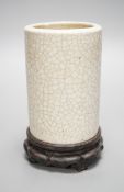 A Chinese crackle glaze brushpot, 19th century, wood stand, 14cm total