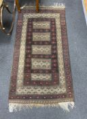 A Belouch geometric rug, 140 x 75cm