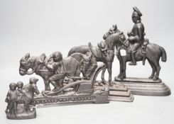 Four assorted cast iron horse door stops, tallest guardsman on horse back 28cms high