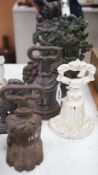 Six assorted Victorian cast iron door stops, some later painted, 27cm tall