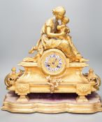 A 19th century 'Mother and child' French ormolu clock on plinth base, 44cm high