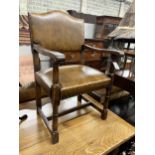 A set of eight reproduction 18th century style brown leather upholstered oak dining chairs, two with