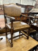 A set of eight reproduction 18th century style brown leather upholstered oak dining chairs, two with