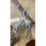 A pair of large cast metal garden crane ornaments, larger height 174cm