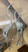 A pair of large cast metal garden crane ornaments, larger height 174cm