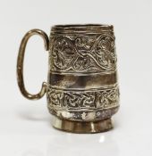 A George V embossed silver Iona mug, by Alexander Ritchie, Chester, 1911, with engraved initials,