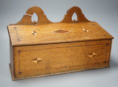 A George III inlaid oak candle box, 38cm wide