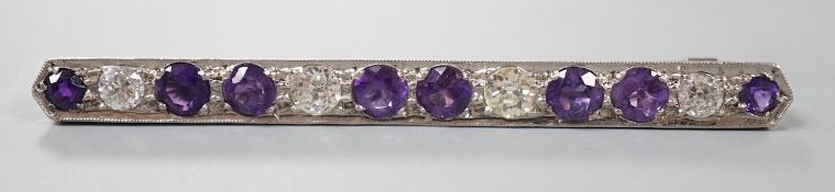 A mid 20th century white metal, amethyst and diamond set bar brooch, 57mm, gross weight 4.5 grams.