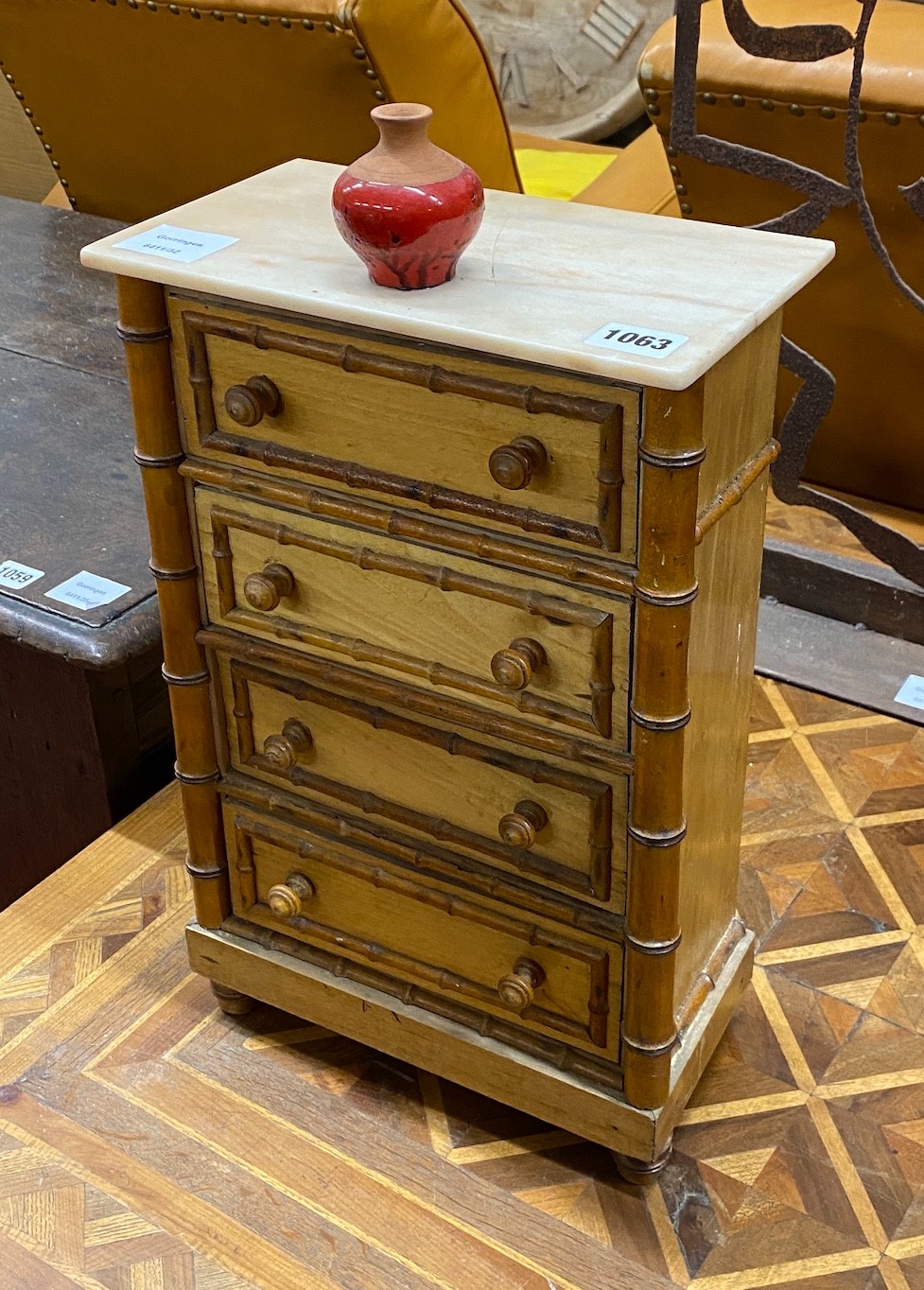 A Victorian style faux bamboo miniature chest, width 26cm, height 41cm