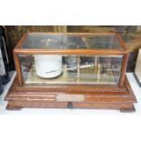 A Negretti and Zambra oak cased barograph number R/20613 with plaque reading ‘To C.C. Prigge as a