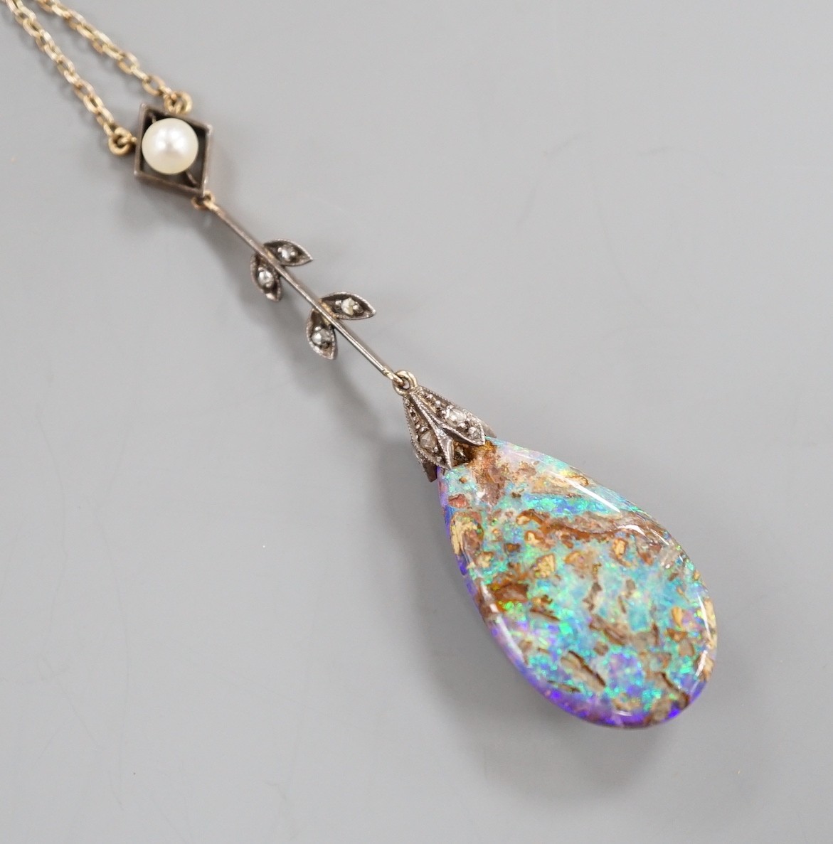 An early 20th century yellow and white metal, pear shaped black opal, rose cut diamond and seed