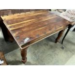 A rectangular Indonesian studded hardwood dining table, width 135cm, depth 90cm, height 79cm