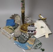A group of mixed 19th century beadwork, cut steel and knitted purses, misers purses and reticules,
