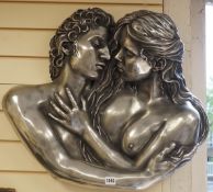 A composite wall mount modelled as embracing lovers, 65cm wide