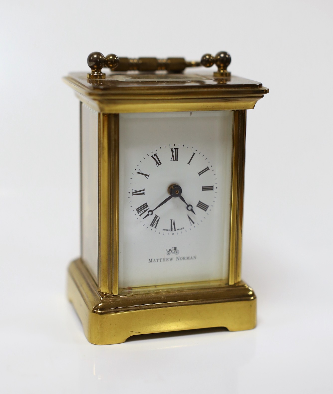 A Matthew Norman small brass carriage timepiece, 8cms high