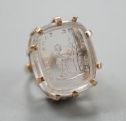 A modern 9ct gold ring, set with earlier oval rock crystal intaglio, the matrix carved with crest