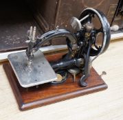 Two cased vintage portable sewing machines, Wilcox and Gibbs, 32cms wide