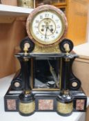 A large Edwardian decorative slate and marble clock, with visible Brocot escapement, height 48cms
