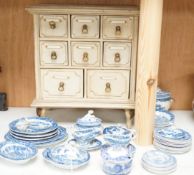 A Victorian toy-size blue and white dinner service and a painted wooden miniature chest,chest