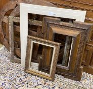 Six assorted rectangular picture frames and two rustic circular wall appliques